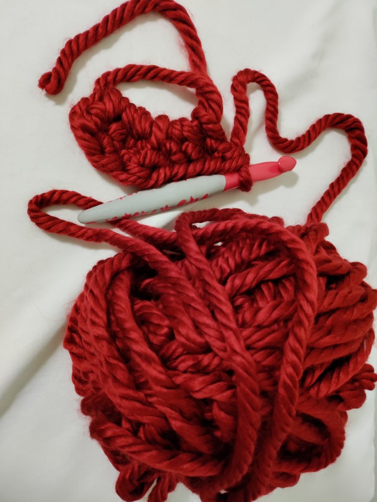 red crochet heart in progress