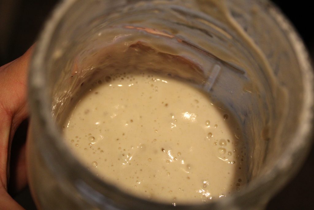 bubbly sourdough starter in a mason jar